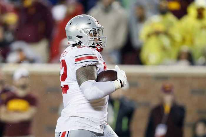 Haskell Garrett (92) scores a touchdown after picking up a fumble against the Minnesota Golden Gophers during the third quarter of the Ohio State season opener. 